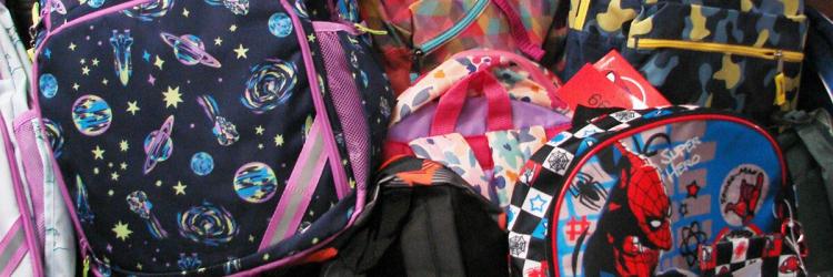 pile of back packs for charity drive in Concord CA