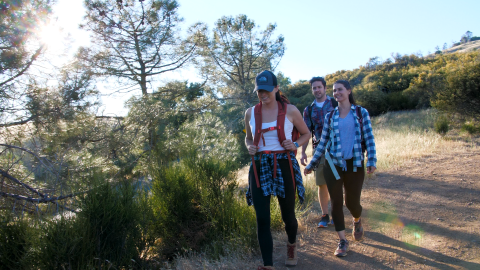 Three people hiking outdoors at Mount Diablo in Concord, CA