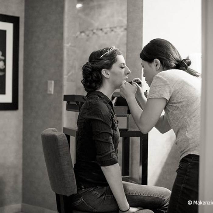 bride and makeup stylist before wedding
