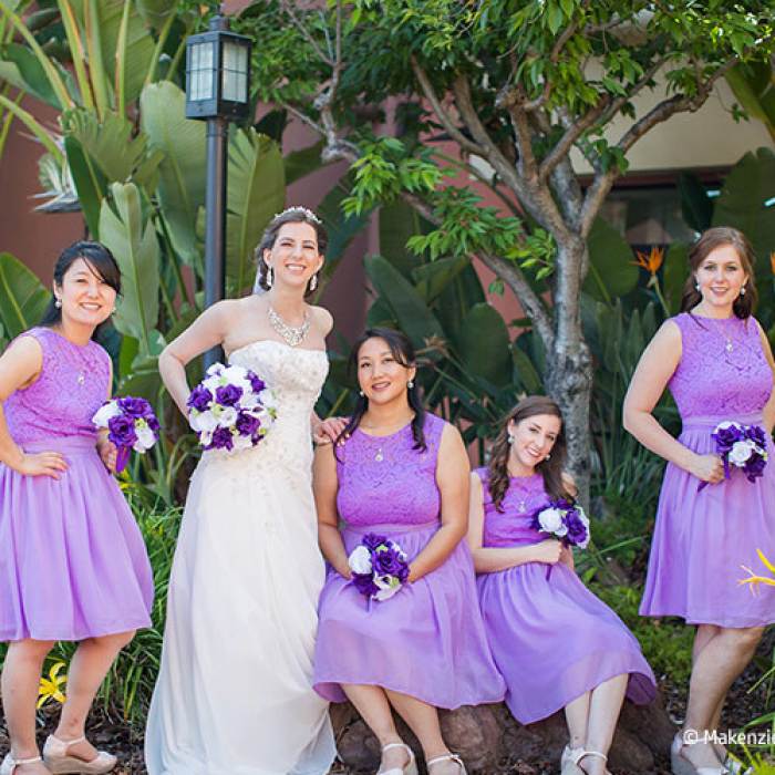 bride and bride's maids posing outside for wedding picture