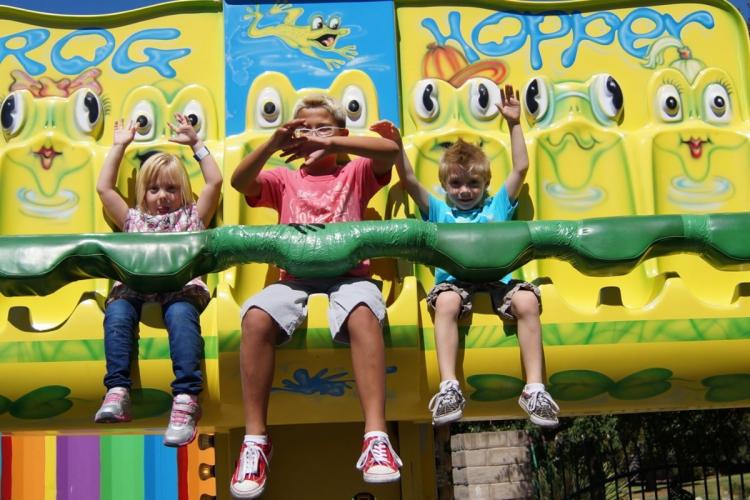 Kids ride a frog-themed ride at Pixieland Amusement Park in Concord, CA