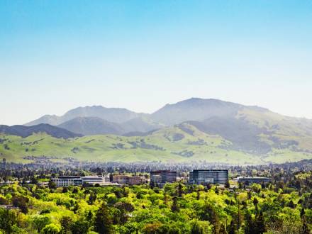 mountain with city buildings in foreground