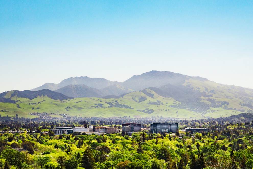 mountain with city buildings in foreground