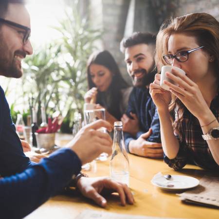 Group of people sitting in a coffee house