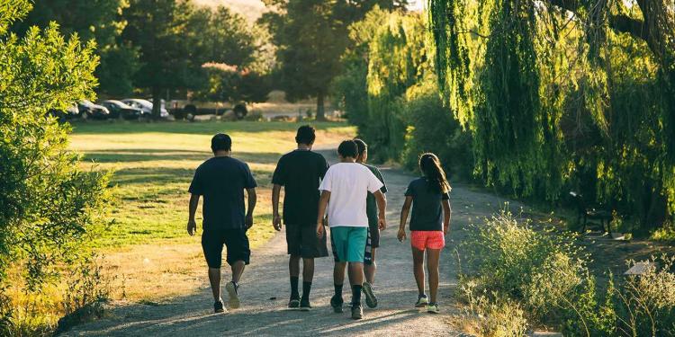 group of kids on a walking trail