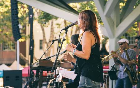 woman singing on stage