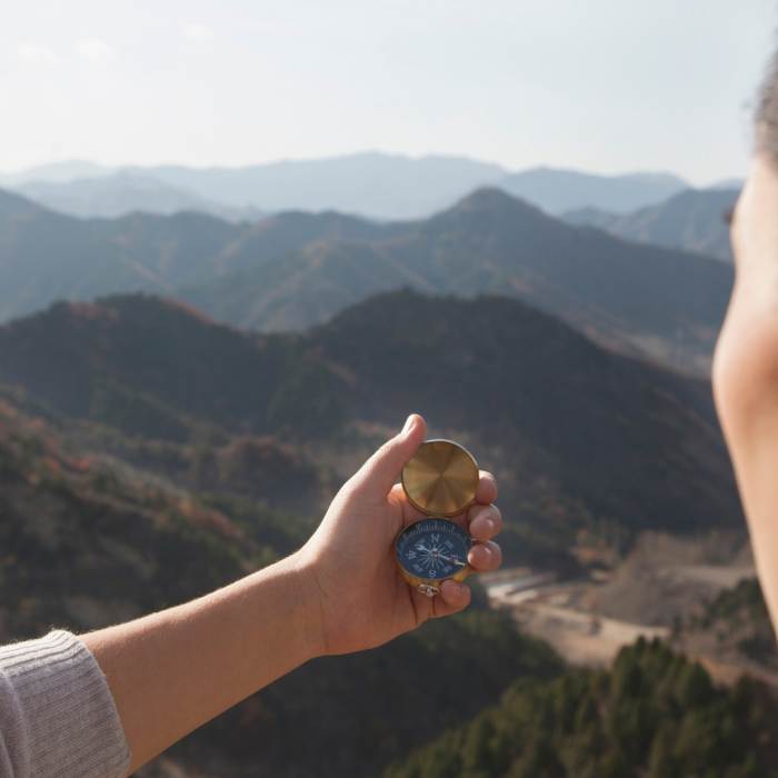 couple reading a compass