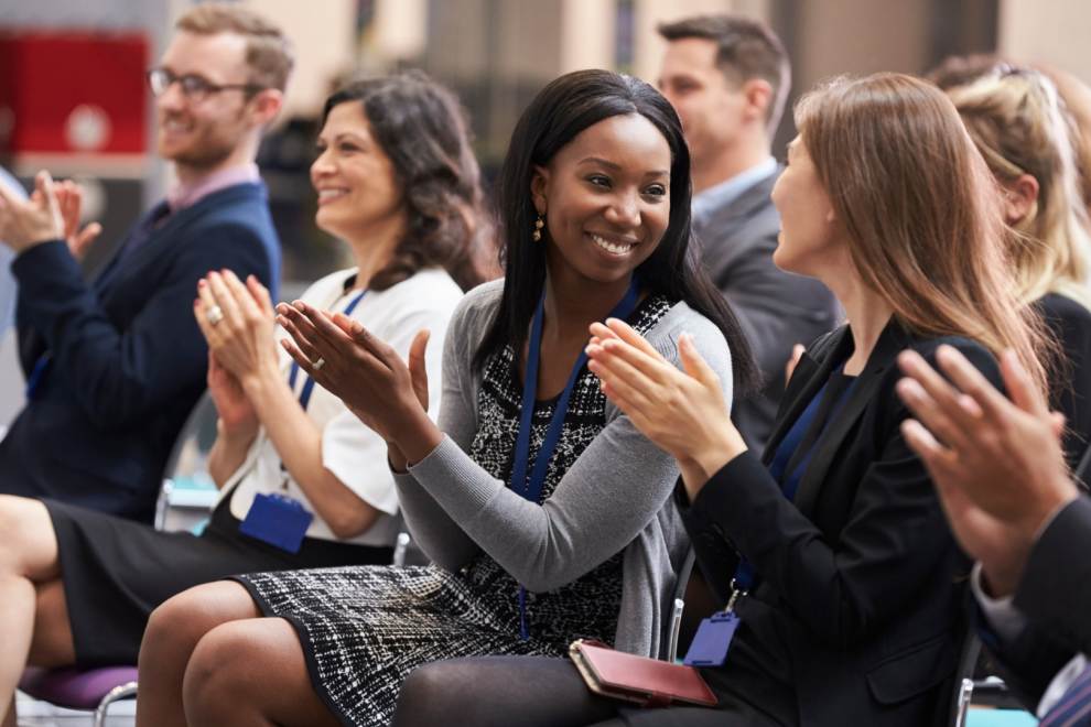 audience clapping during seminar